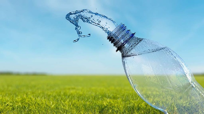 bottled water splash on grassy field